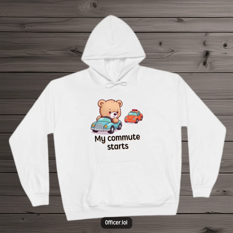 Funny Bear Cub Director Hoodie: A comfortable hoodie illustrating a gentle bear cub meticulously directing a row of small toy vehicles.