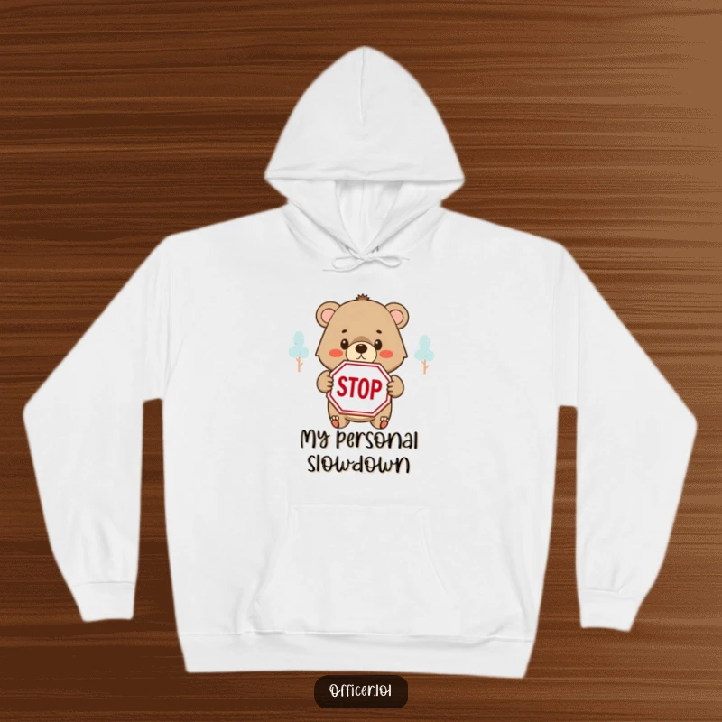 Funny hoodie featuring a determined bear cub holding a STOP sign with a kind, thoughtful expression.